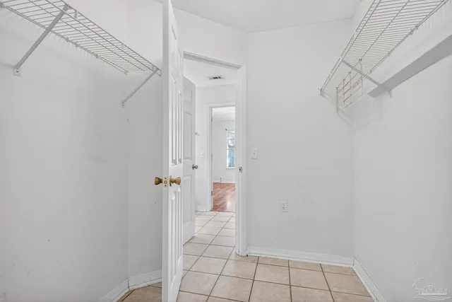 a view of a house with backyard porch and sitting area