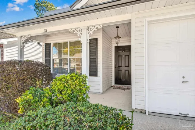 a view of a chairs and table in a patio