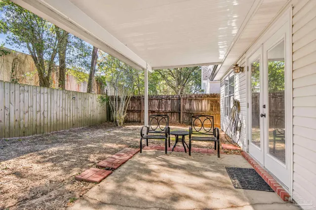 a view of a swimming pool and an outdoor space
