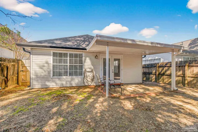 a view of a yard with large trees
