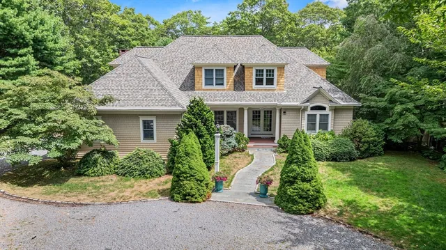 a front view of a house with a yard