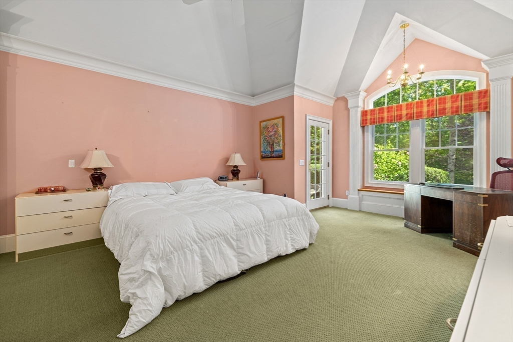 58 The Hacking Circle Mashpee, MA 02649 - Photo 14 of 37 a spacious bedroom with a bed and a large window