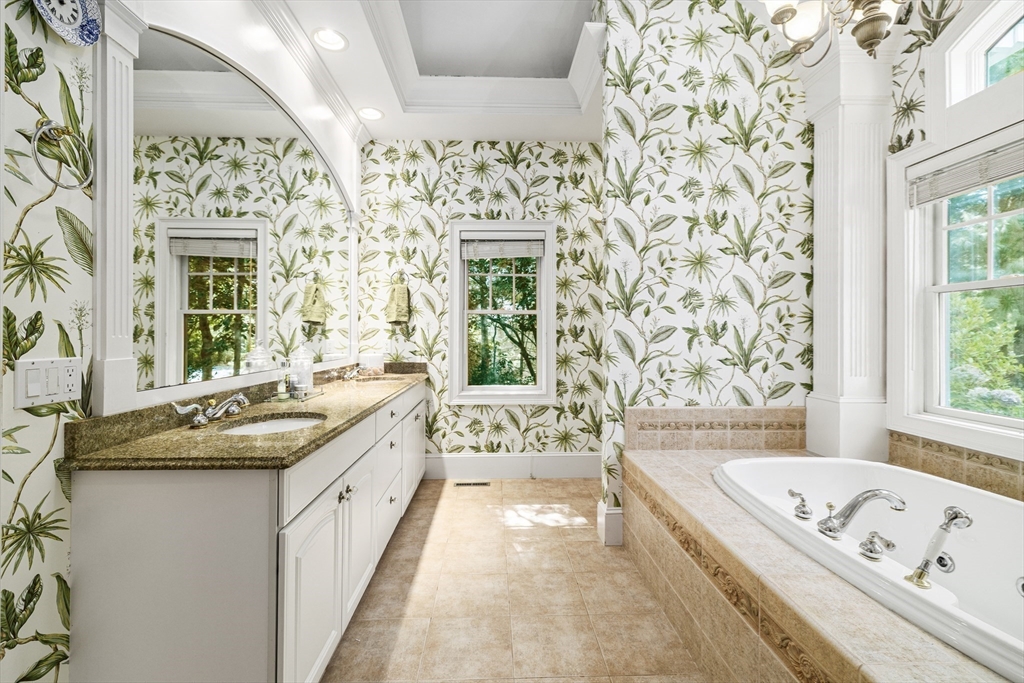 58 The Hacking Circle Mashpee, MA 02649 - Photo 15 of 37 a bathroom with a granite countertop tub sink and mirror