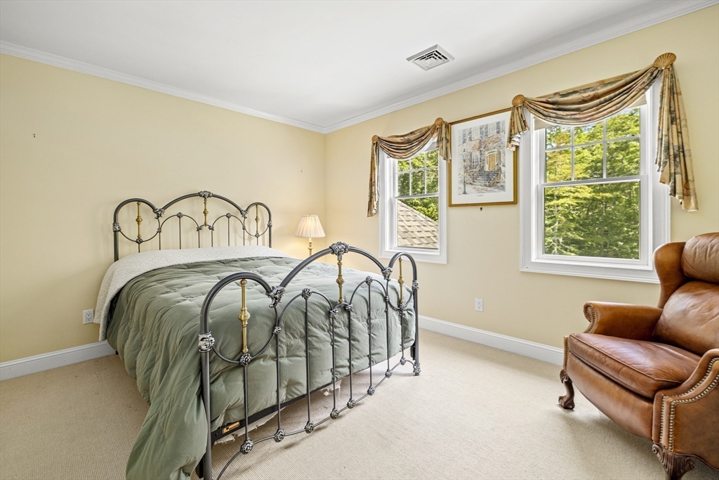 58 The Hacking Circle Mashpee, MA 02649 - Photo 20 of 37 a bedroom with a bed and a large window