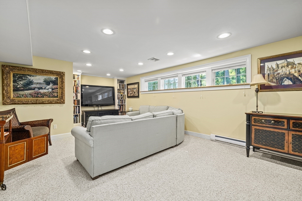 58 The Hacking Circle Mashpee, MA 02649 - Photo 24 of 37 a living room with furniture and a flat screen tv