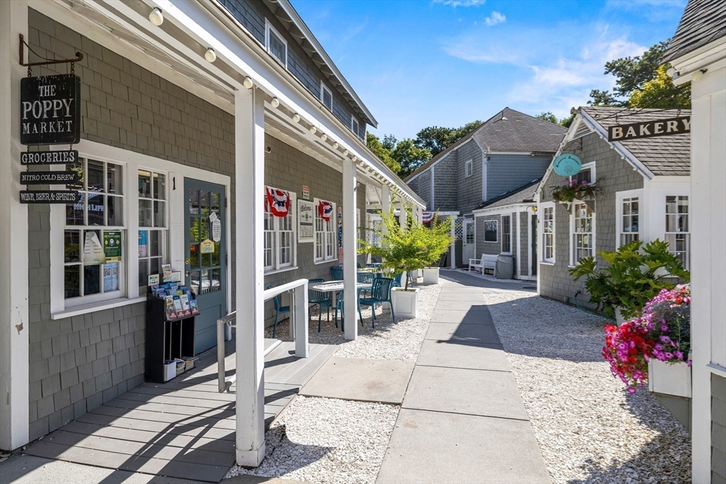 58 The Hacking Circle Mashpee, MA 02649 - Photo 28 of 37 a view of a house with a potted plant ana a small yard