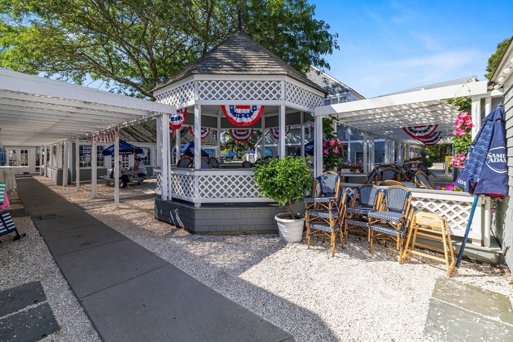 58 The Hacking Circle Mashpee, MA 02649 - Photo 30 of 37 a view of a chairs and tables in patio