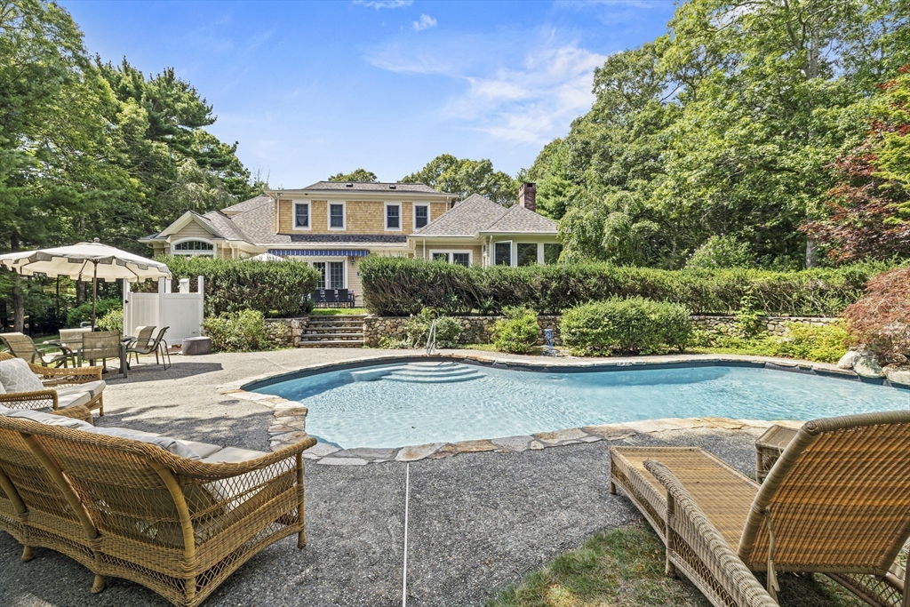 58 The Hacking Circle Mashpee, MA 02649 - Photo 36 of 37 a swimming pool view with a seating space and a garden view