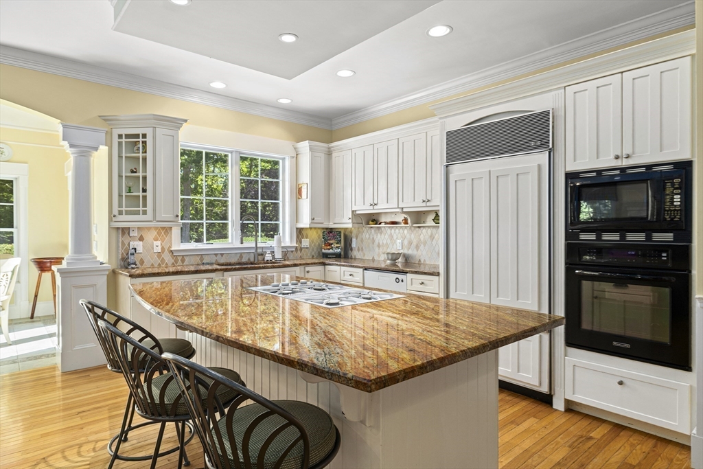 58 The Hacking Circle Mashpee, MA 02649 - Photo 4 of 37 a kitchen with granite countertop a stove and a refrigerator