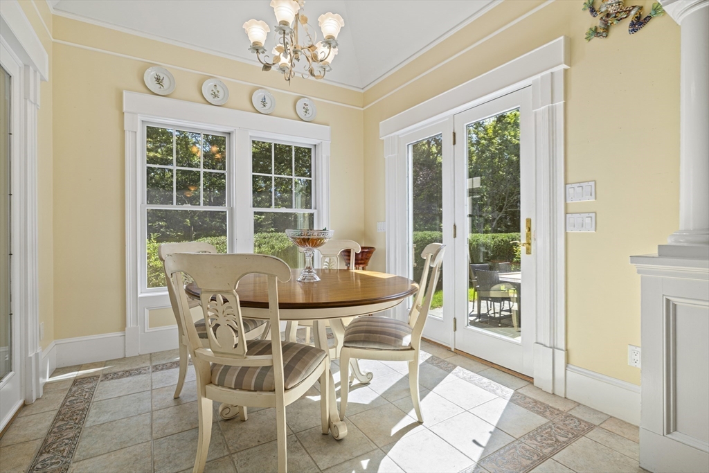 58 The Hacking Circle Mashpee, MA 02649 - Photo 7 of 37 a dining room with furniture a chandelier and wooden floor