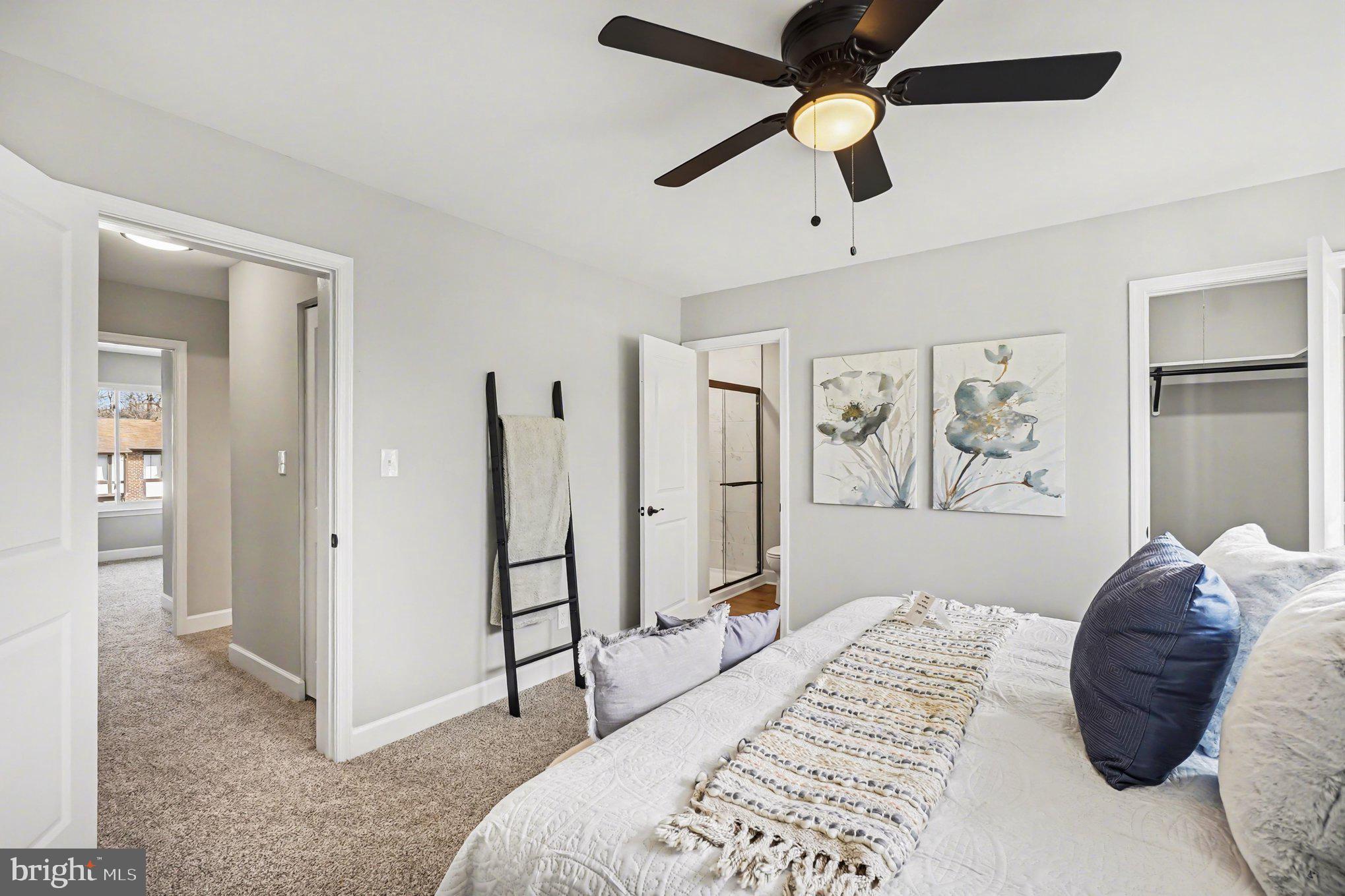 32 Romanoff Court Baltimore, MD 21234 - Photo 12 of 26 a bedroom with a bed and a chandelier