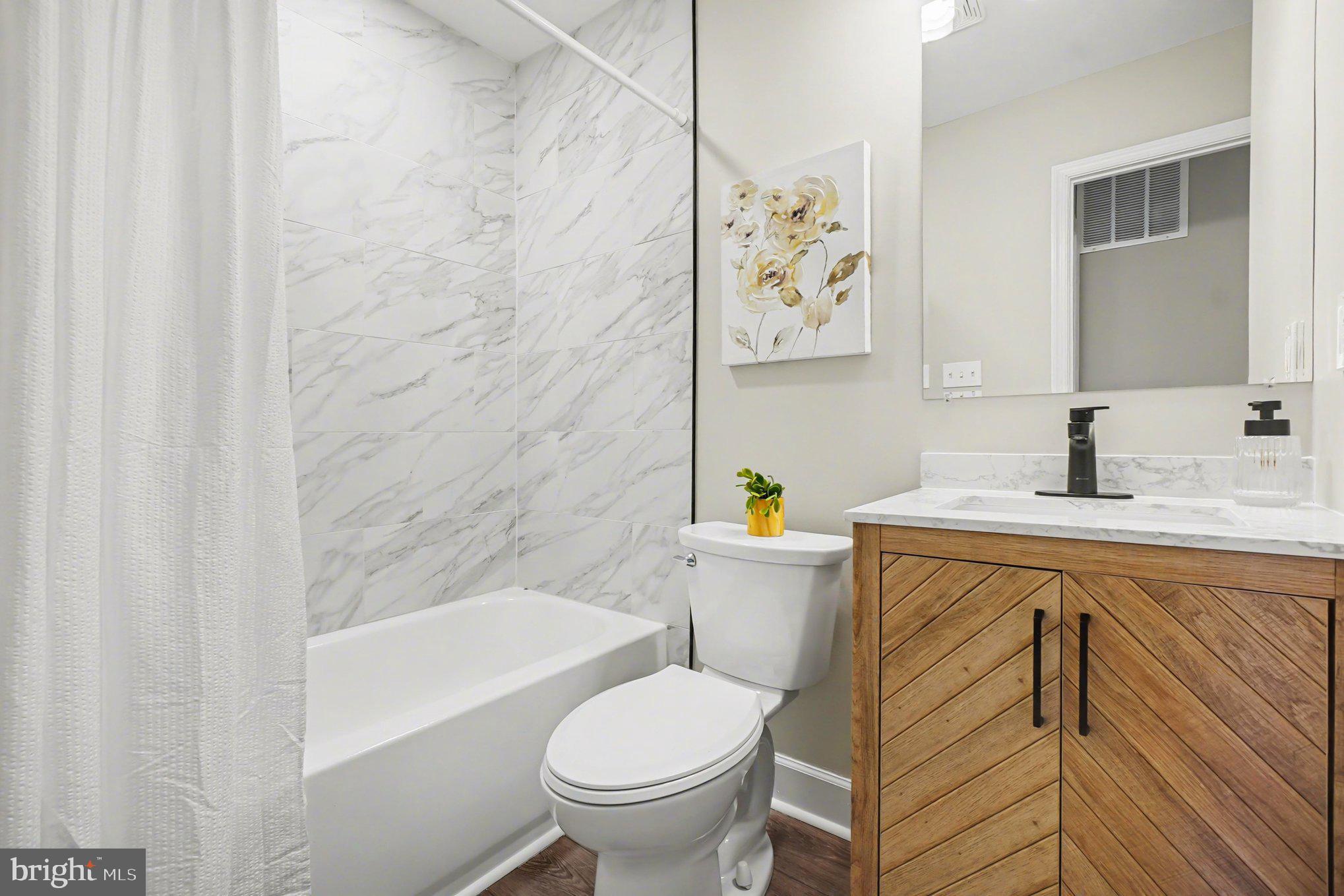 32 Romanoff Court Baltimore, MD 21234 - Photo 17 of 26 a bathroom with a sink toilet and bathtub