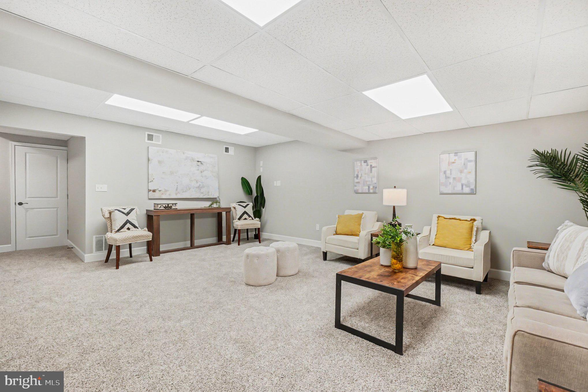 32 Romanoff Court Baltimore, MD 21234 - Photo 22 of 26 a living room with furniture and a table