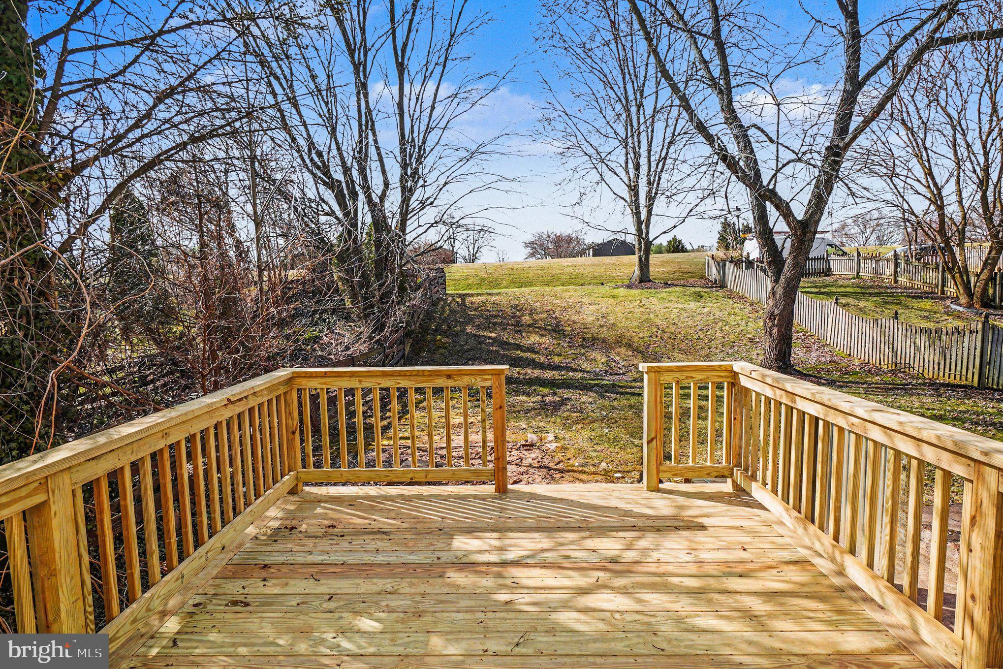 32 Romanoff Court Baltimore, MD 21234 - Photo 26 of 26 a view of a balcony with wooden fence