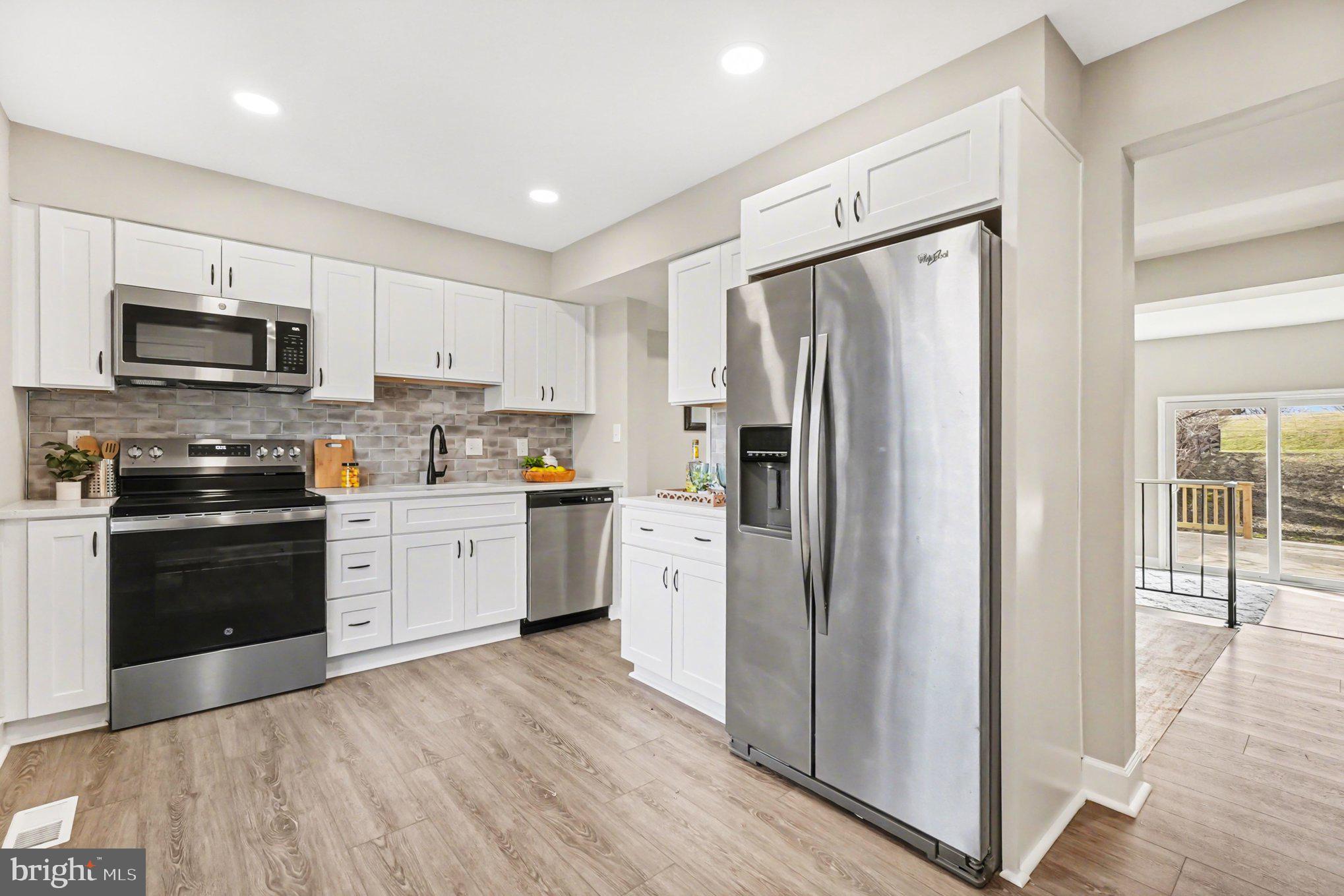 32 Romanoff Court Baltimore, MD 21234 - Photo 4 of 26 a kitchen with a refrigerator stove and sink
