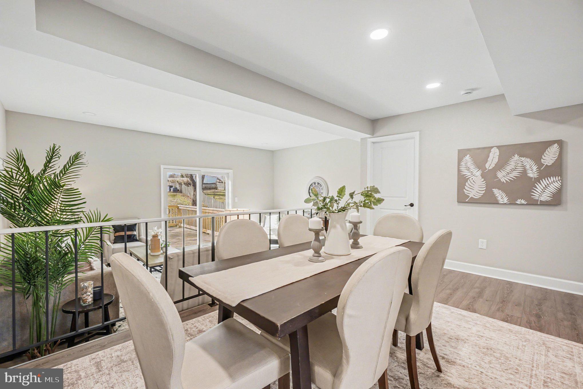 32 Romanoff Court Baltimore, MD 21234 - Photo 8 of 26 a view of a dining room with furniture window and wooden floor