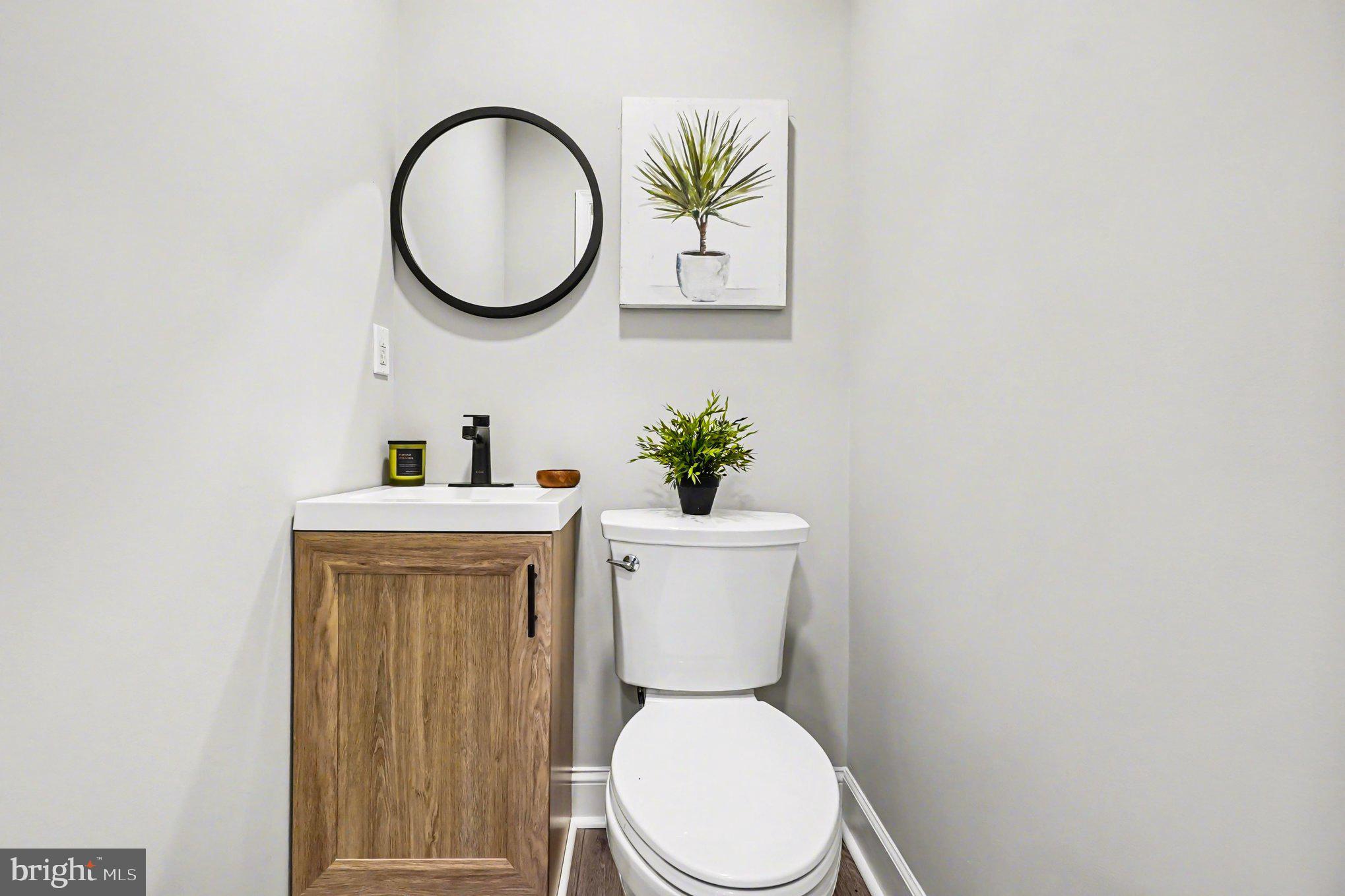 32 Romanoff Court Baltimore, MD 21234 - Photo 9 of 26 a bathroom with a toilet and a sink