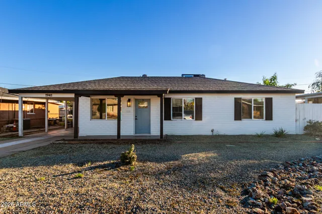 front view of a house with a yard