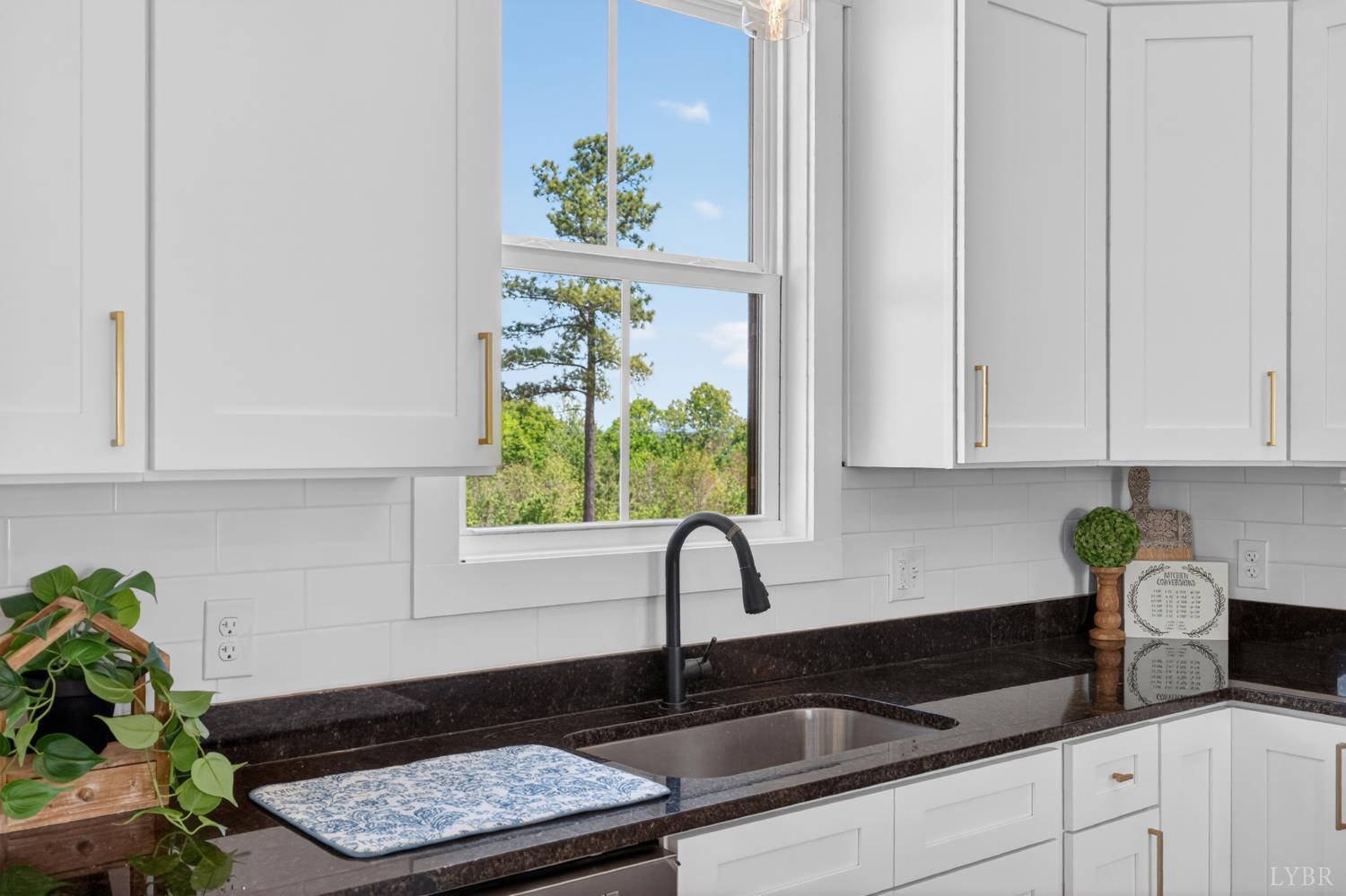 20 Fox Hall Drive Amherst, VA 24521 - Photo 18 of 46 a kitchen with stainless steel appliances granite countertop a sink a stove and a window