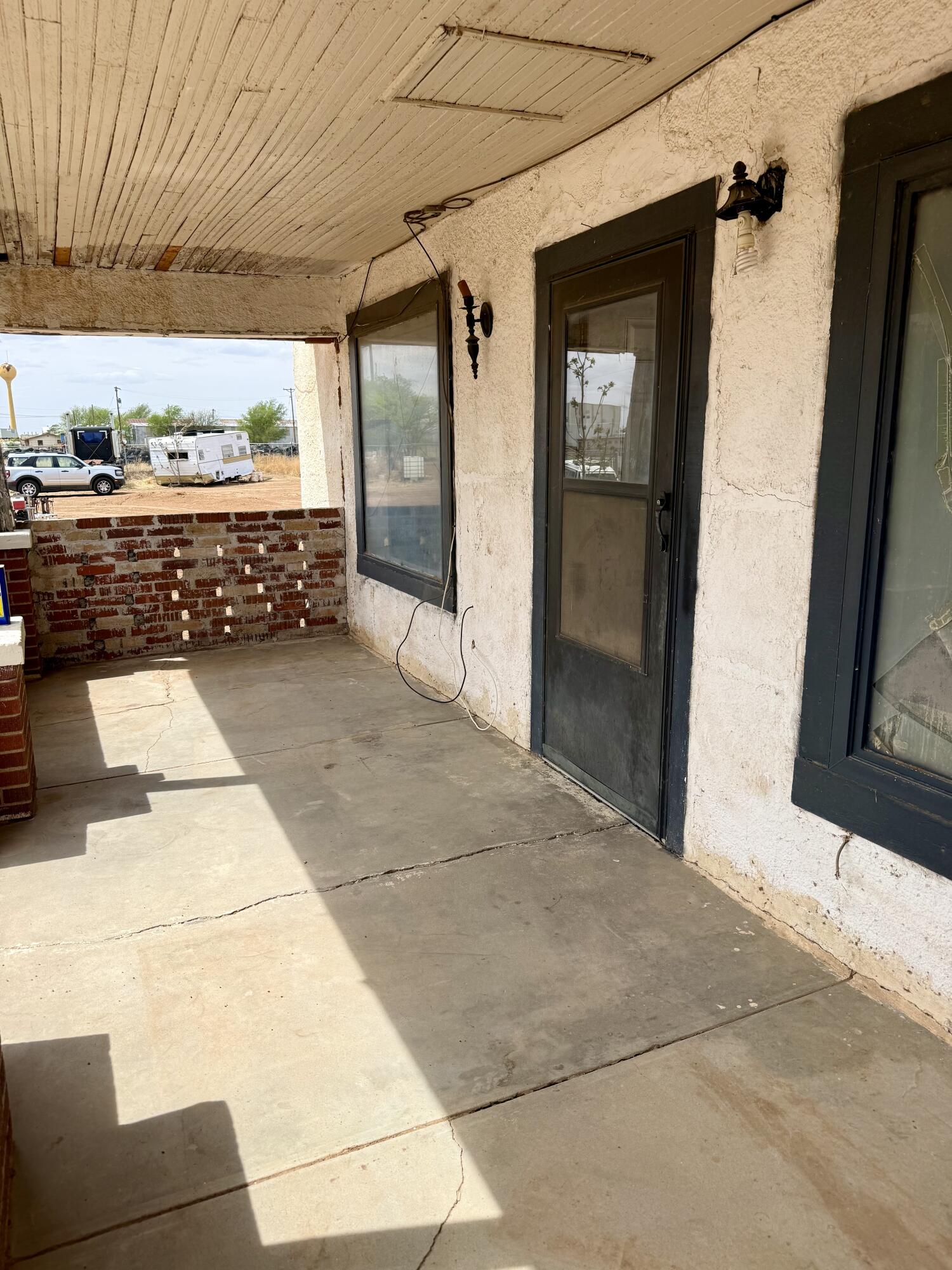 2833 East 53rd Street Lubbock, TX 79404 - Photo 17 of 30 a view of a porch with a table and chairs