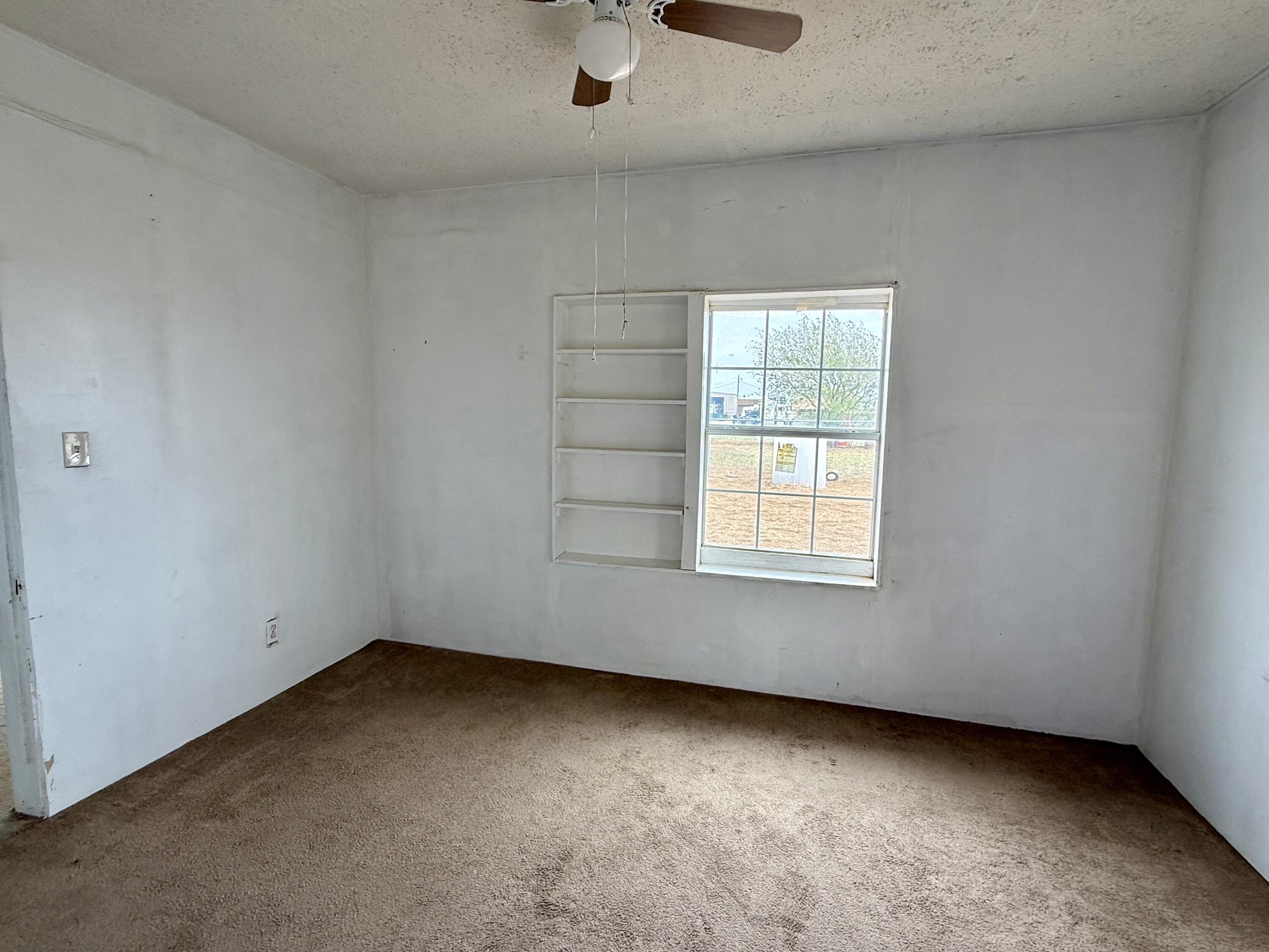 2833 East 53rd Street Lubbock, TX 79404 - Photo 7 of 30 an empty room with a window