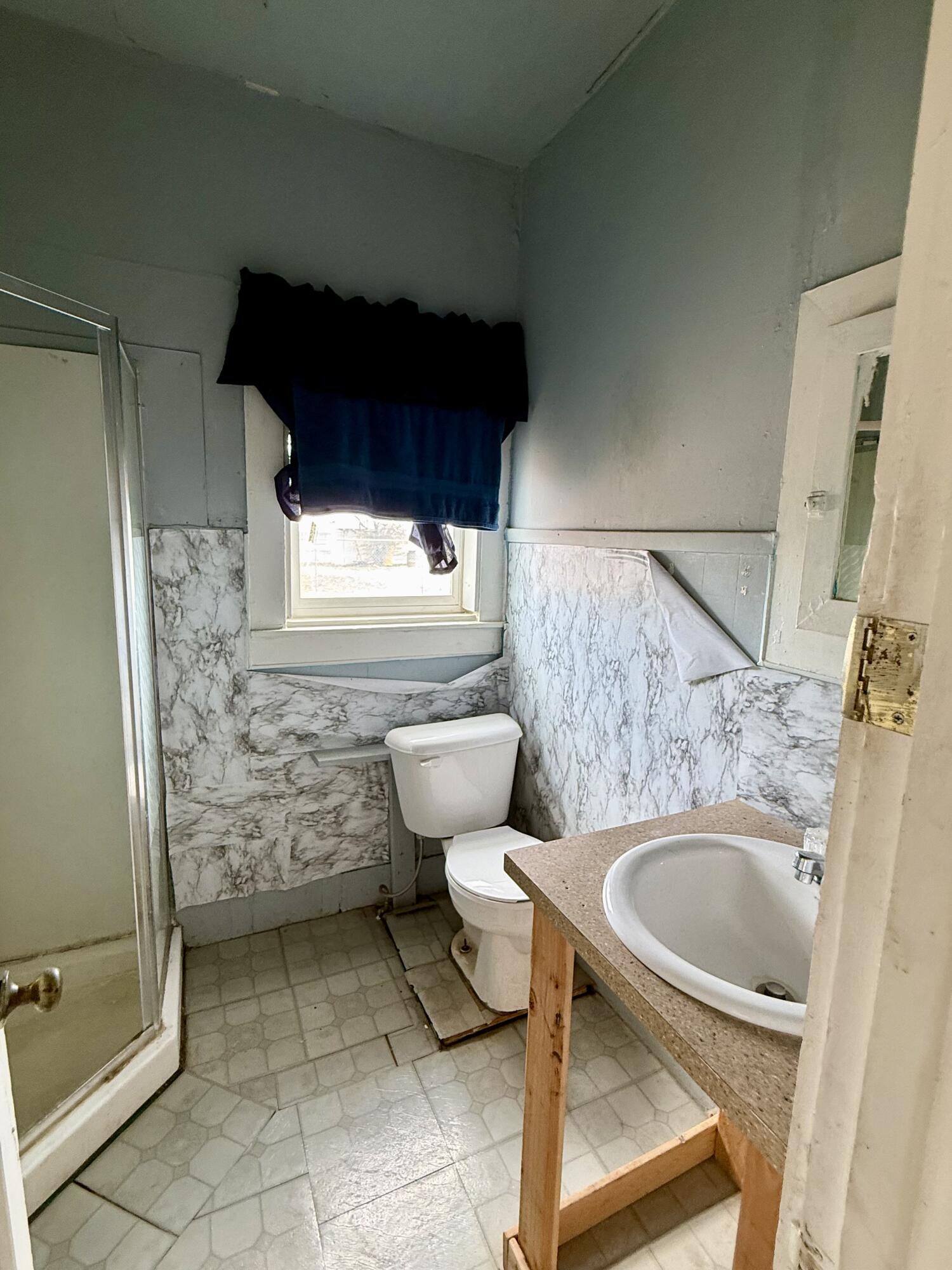 2833 East 53rd Street Lubbock, TX 79404 - Photo 9 of 30 a bathroom with a sink and a toilet