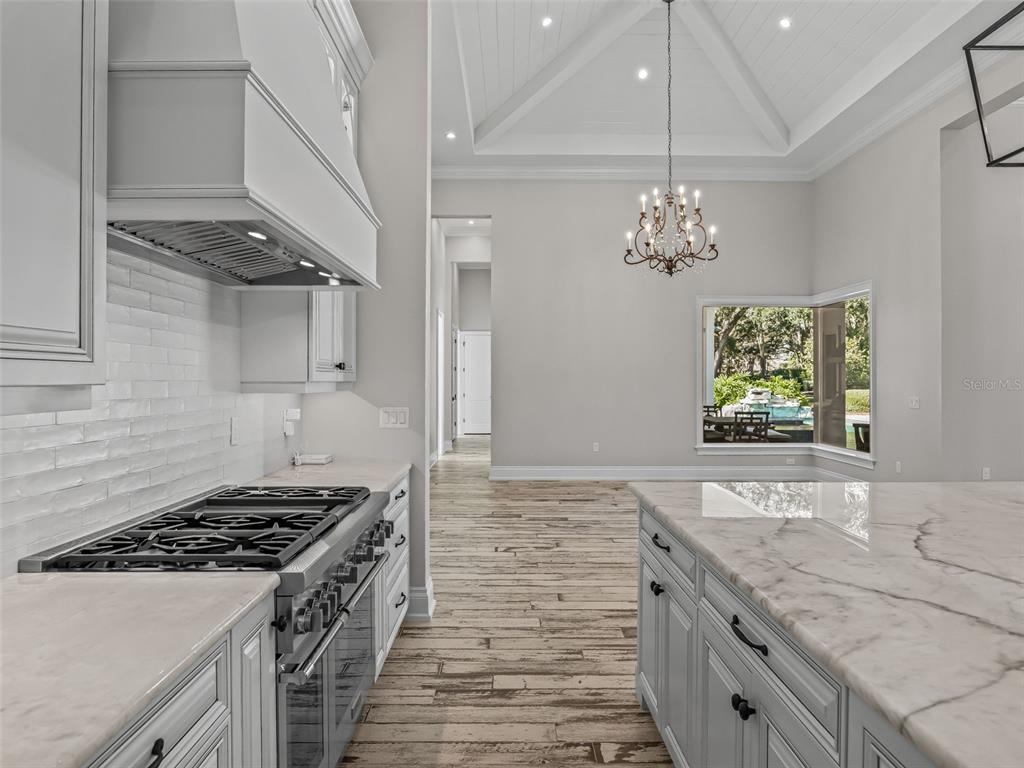 8746 Northwest 31st Lane Road Ocala, FL 34482 - Photo 19 of 89 a kitchen with stove and cabinets