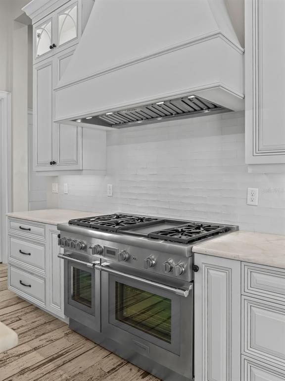 8746 Northwest 31st Lane Road Ocala, FL 34482 - Photo 20 of 89 a stove top oven sitting inside of a kitchen