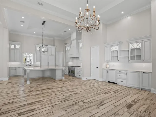a view of a room with wooden floor and bathroom