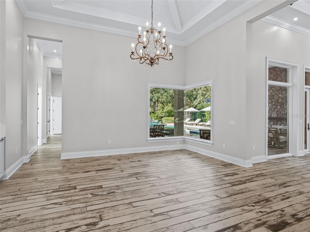 8746 Northwest 31st Lane Road Ocala, FL 34482 - Photo 25 of 89 a view of an empty room with wooden floor and a window