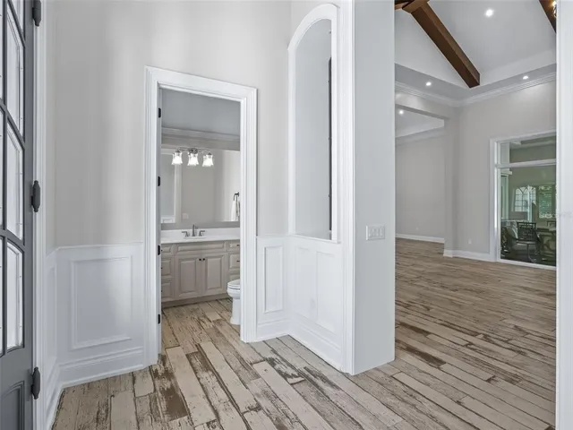 a bathroom with a shower sink and mirror
