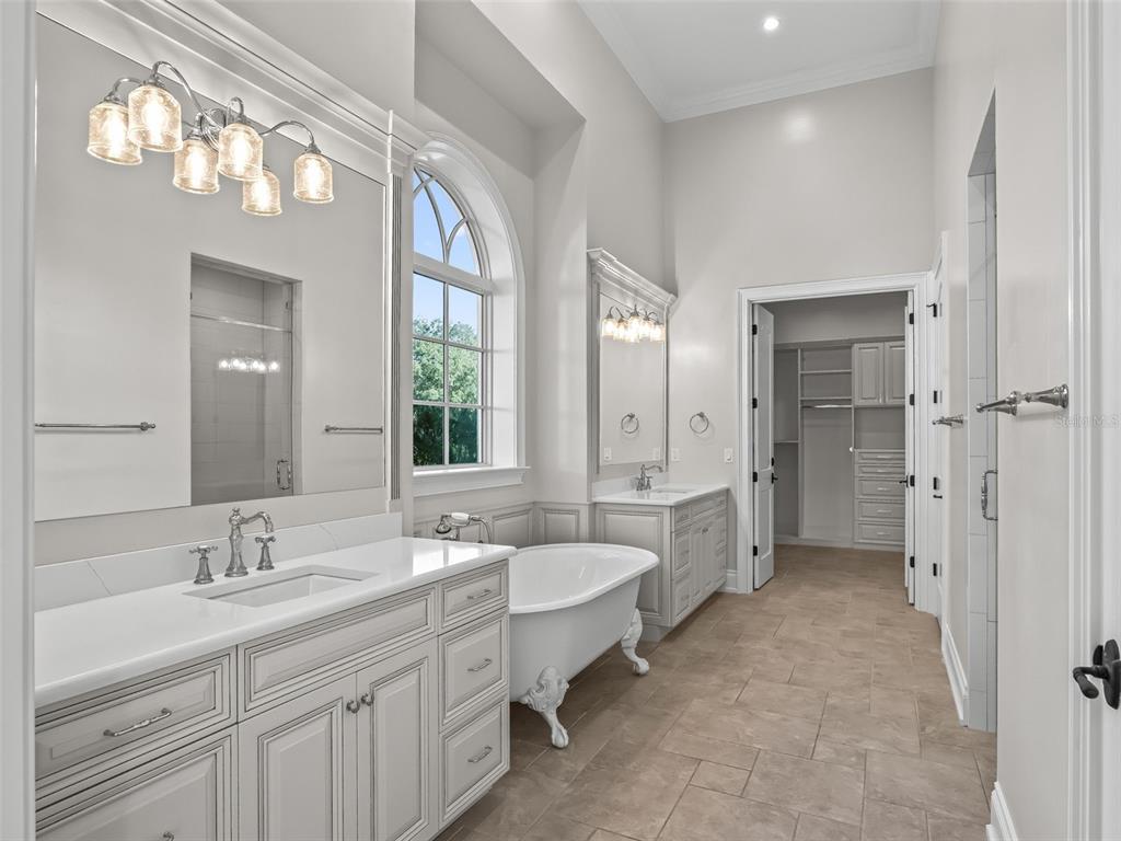 8746 Northwest 31st Lane Road Ocala, FL 34482 - Photo 35 of 89 a spacious bathroom with a double vanity sink mirror and double