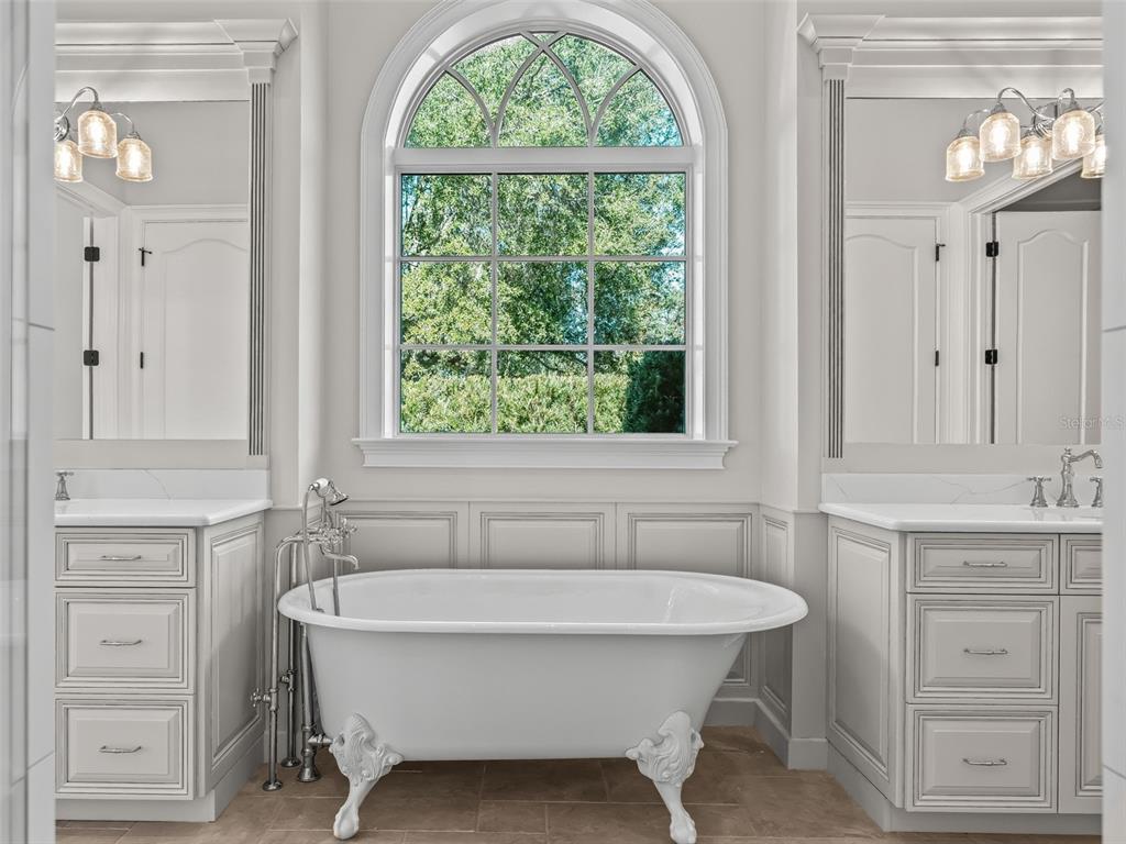 8746 Northwest 31st Lane Road Ocala, FL 34482 - Photo 38 of 89 a spacious bathroom with a bathtub and a sink