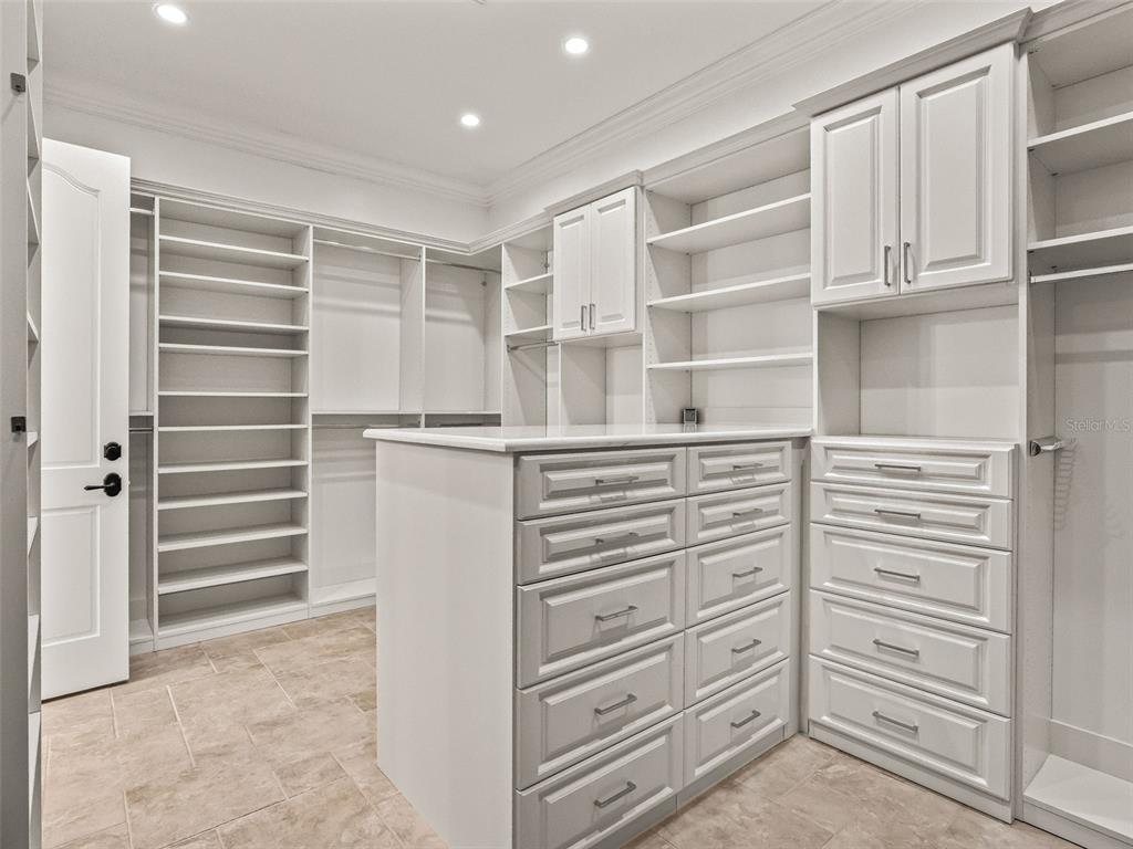 8746 Northwest 31st Lane Road Ocala, FL 34482 - Photo 41 of 89 a view of walk in closet with empty racks