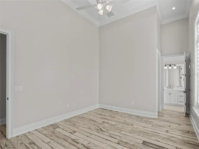 a patio with a table and chairs under an umbrella