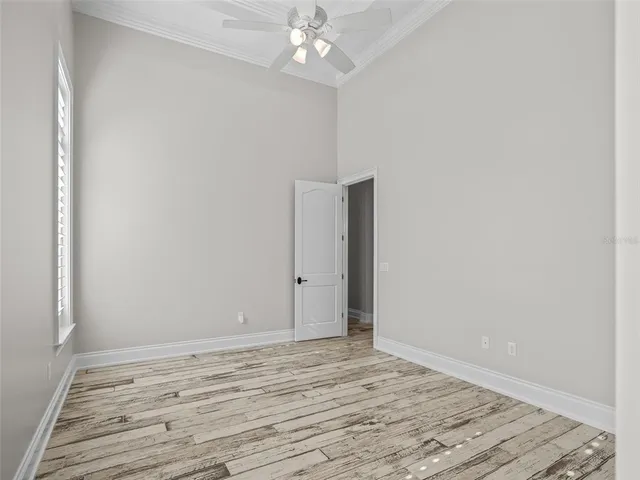 a front view of a house with swimming pool having patio