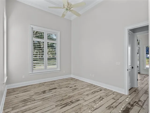 a front view of house with yard and trees