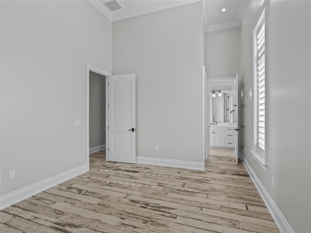 8746 Northwest 31st Lane Road Ocala, FL 34482 - Photo 48 of 89 a view of a room with wooden floor and bathroom