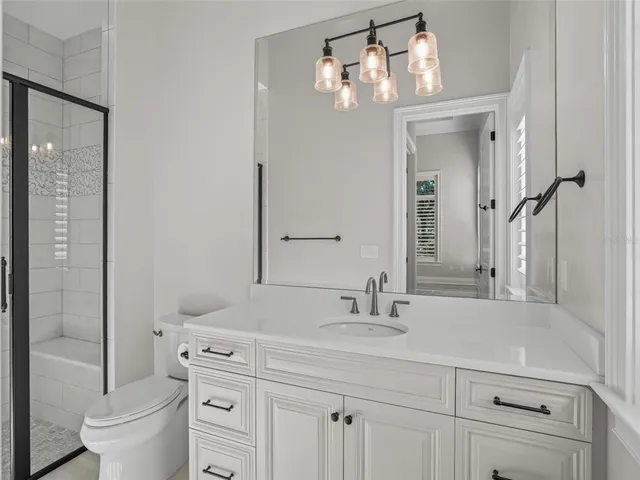 an aerial view of residential building and lake