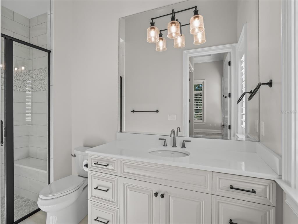 8746 Northwest 31st Lane Road Ocala, FL 34482 - Photo 50 of 89 a bathroom with a sink a toilet and shower