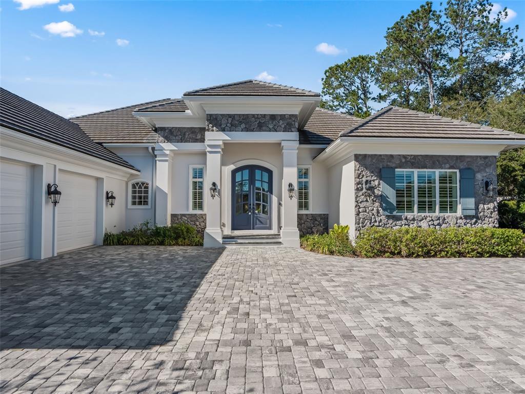 8746 Northwest 31st Lane Road Ocala, FL 34482 - Photo 6 of 89 a front view of a house with a garden