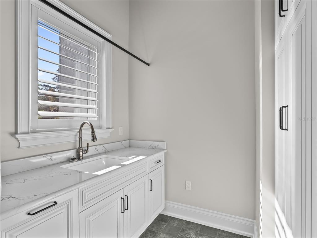 8746 Northwest 31st Lane Road Ocala, FL 34482 - Photo 63 of 89 a bathroom with a sink and a mirror