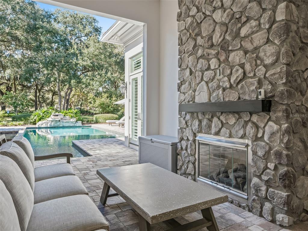 8746 Northwest 31st Lane Road Ocala, FL 34482 - Photo 66 of 89 a balcony with a table and chairs