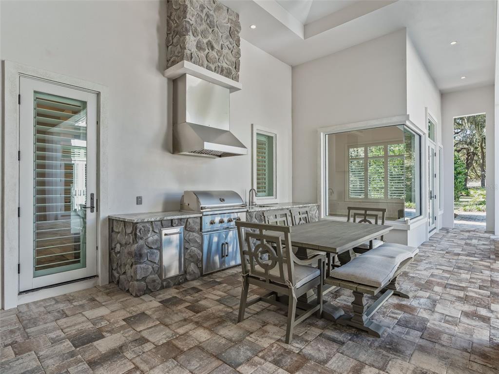 8746 Northwest 31st Lane Road Ocala, FL 34482 - Photo 68 of 89 a view of a dining room with furniture