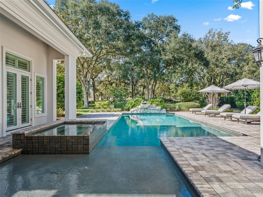 8746 Northwest 31st Lane Road Ocala, FL 34482 - Photo 74 of 89 a swimming pool with outdoor seating and yard