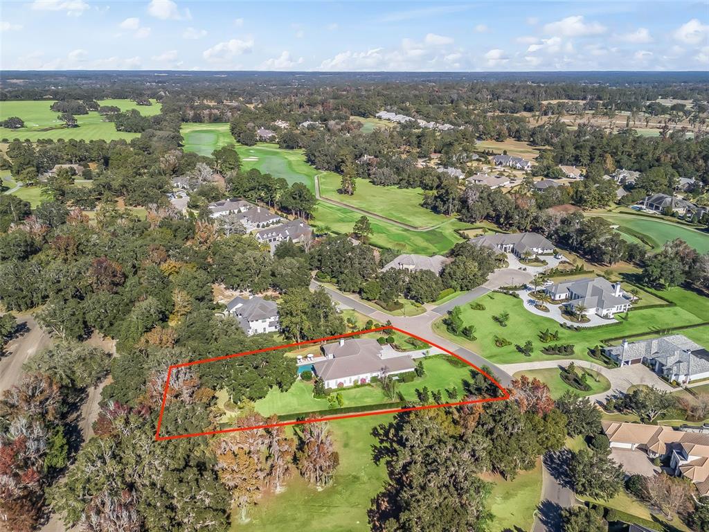 8746 Northwest 31st Lane Road Ocala, FL 34482 - Photo 86 of 89 an aerial view of residential houses with outdoor space and trees
