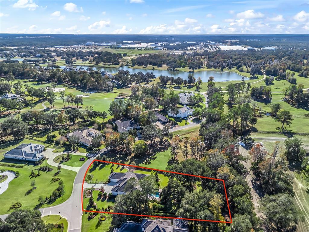 8746 Northwest 31st Lane Road Ocala, FL 34482 - Photo 88 of 89 an aerial view of lake and residential houses with outdoor space