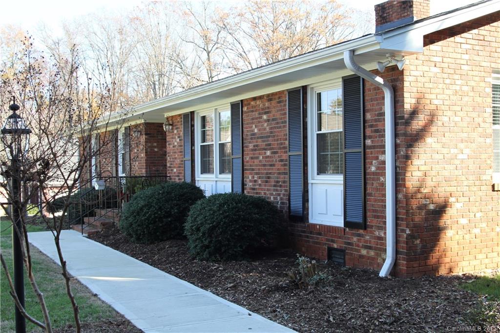 402 Stowe Road Belmont, NC 28012 - Photo 2 of 8 a front view of a house with garden