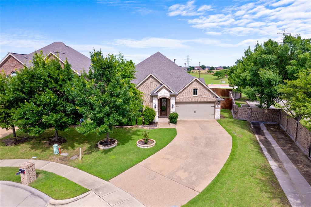 600 Fishback Circle Plano, TX 75074 - Photo 2 of 38 a view of house with garden space and trees