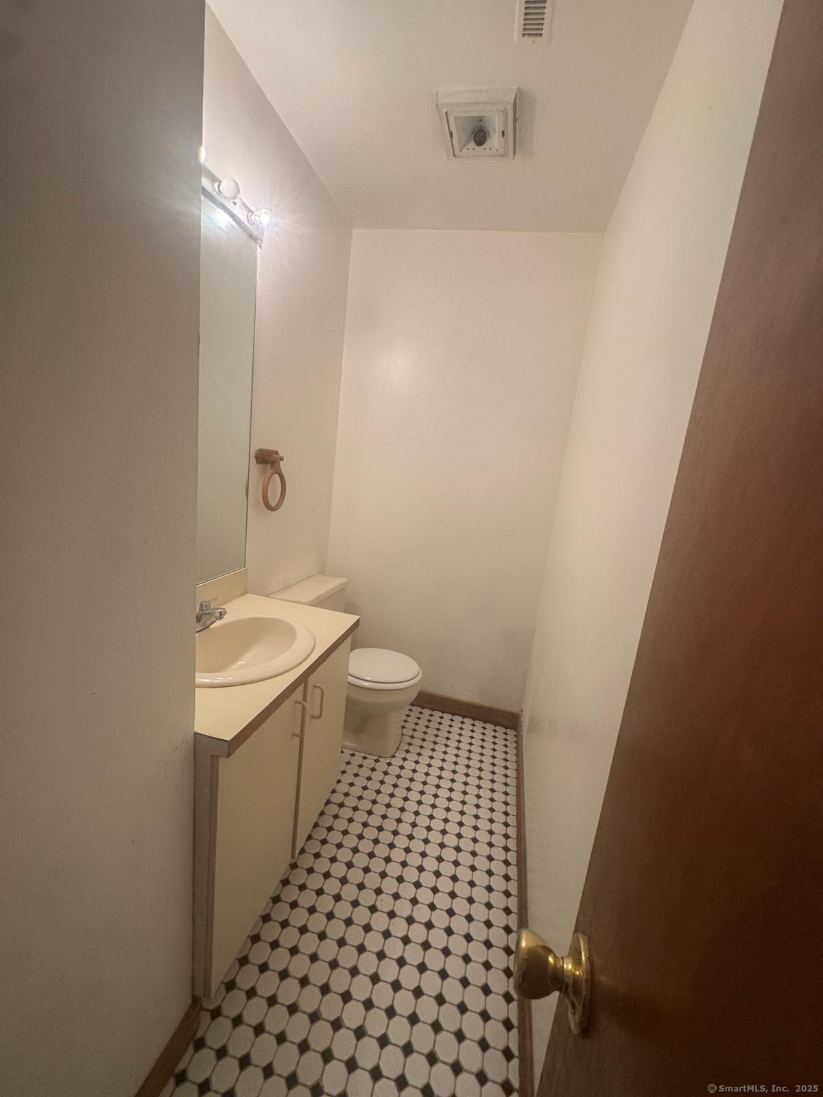 204 Wheeler Avenue, Unit 6 Bridgeport, CT 06606 - Photo 12 of 15 a bathroom with a sink a toilet and shower